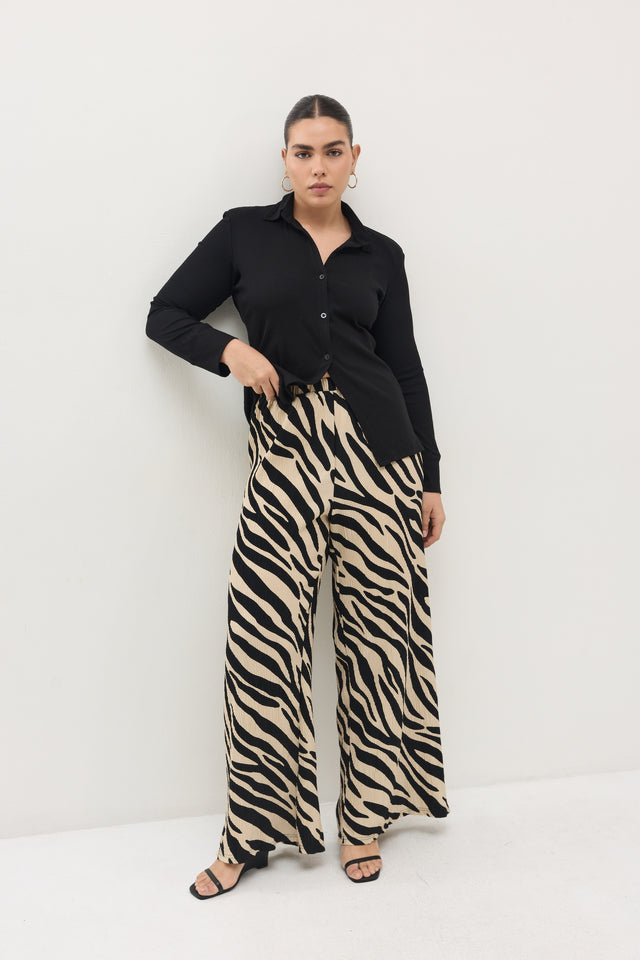 מכנסיים ספיריט פליסה בז׳ שחור