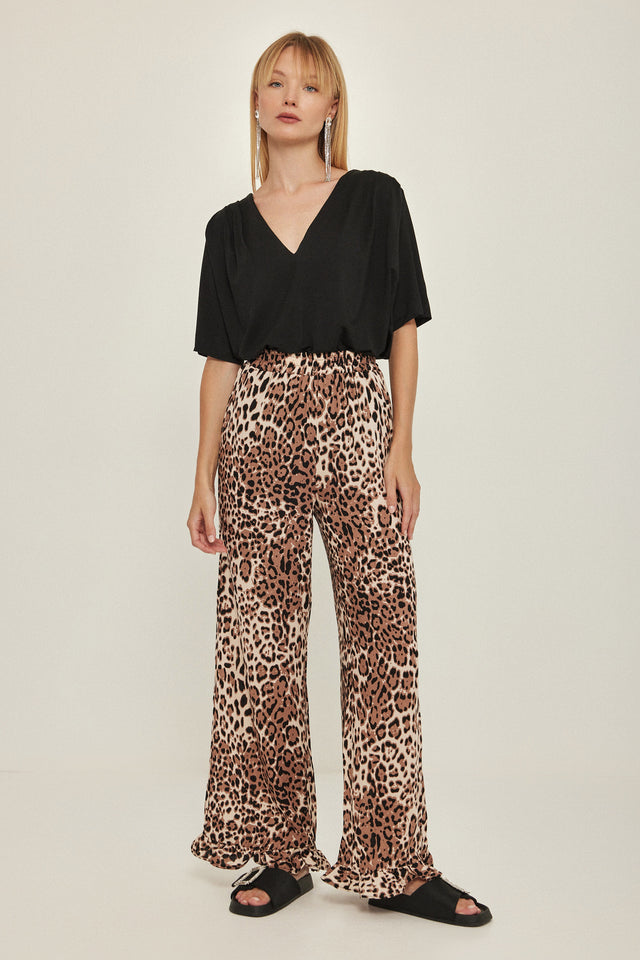 מכנסיים וייב כותנה גומי ודיטייל פפלום ארוכים מנומרים