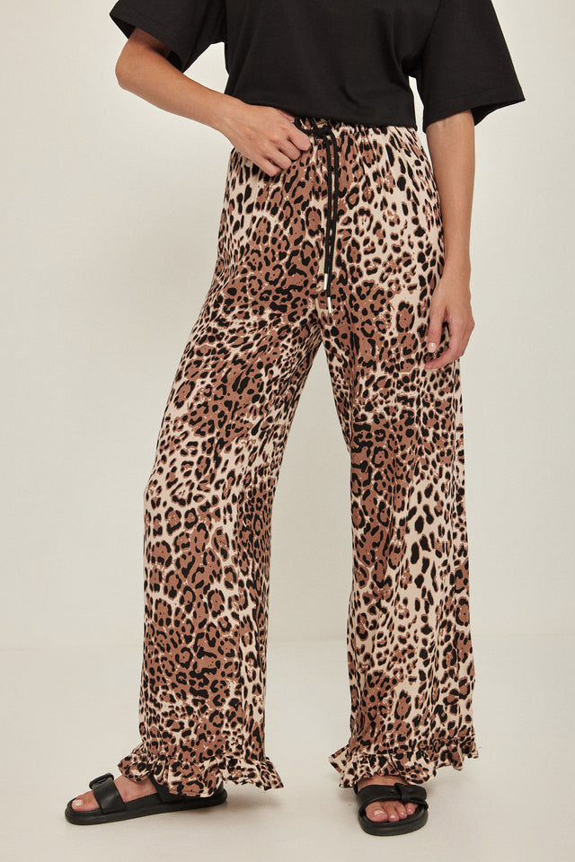 מכנסיים וייב כותנה גומי ודיטייל פפלום ארוכים מנומרים