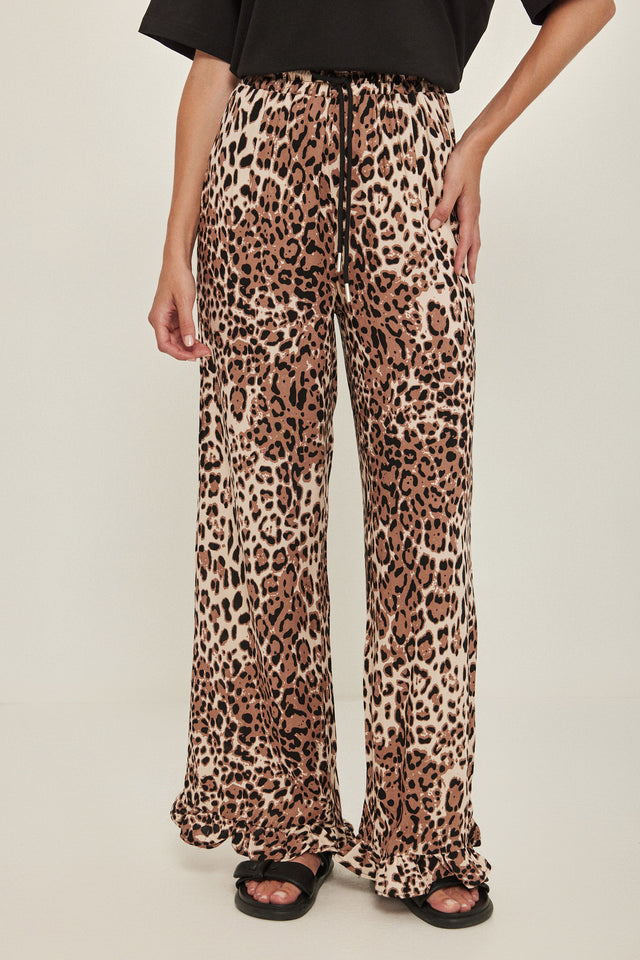 מכנסיים וייב כותנה גומי ודיטייל פפלום ארוכים מנומרים