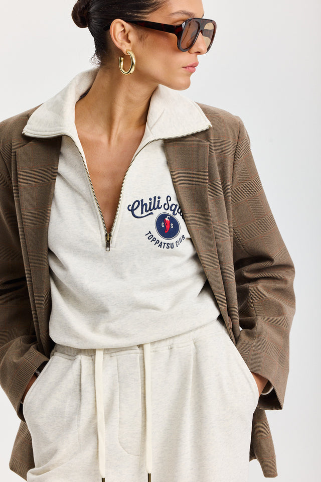 סווטשירט זיפר ספייסי צ'ילי סקווד שמנת מלאנז'