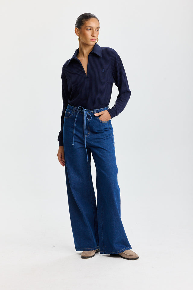 מכנסי ג'ינס טופו מתרחבים קשירה כחול כהה