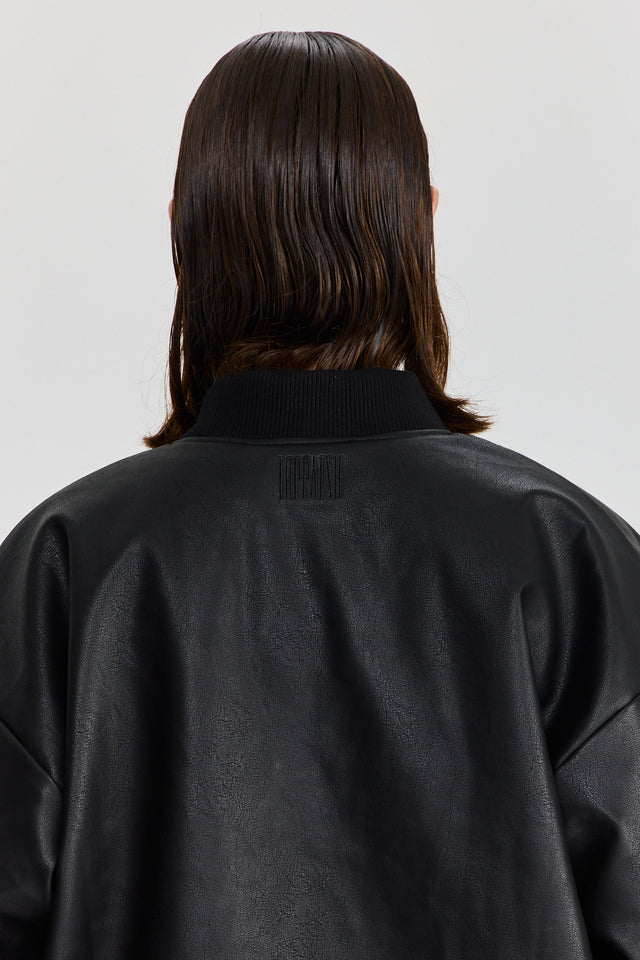 מעיל פנטאסי דו צדדי דמוי עור ופרווה שחור