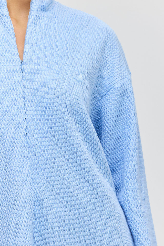 חולצת זיפר סריג ספייסי שרוולים ארוכים תכלת