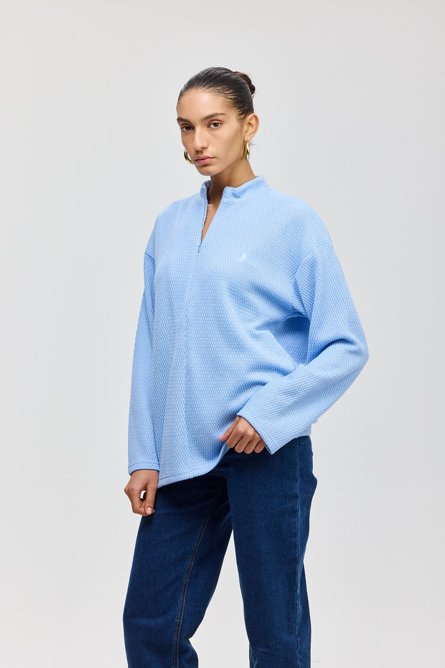 חולצת זיפר סריג ספייסי שרוולים ארוכים תכלת