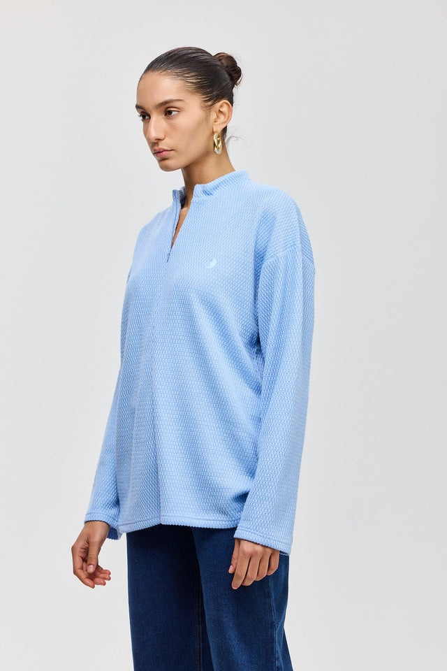 חולצת זיפר סריג ספייסי שרוולים ארוכים תכלת