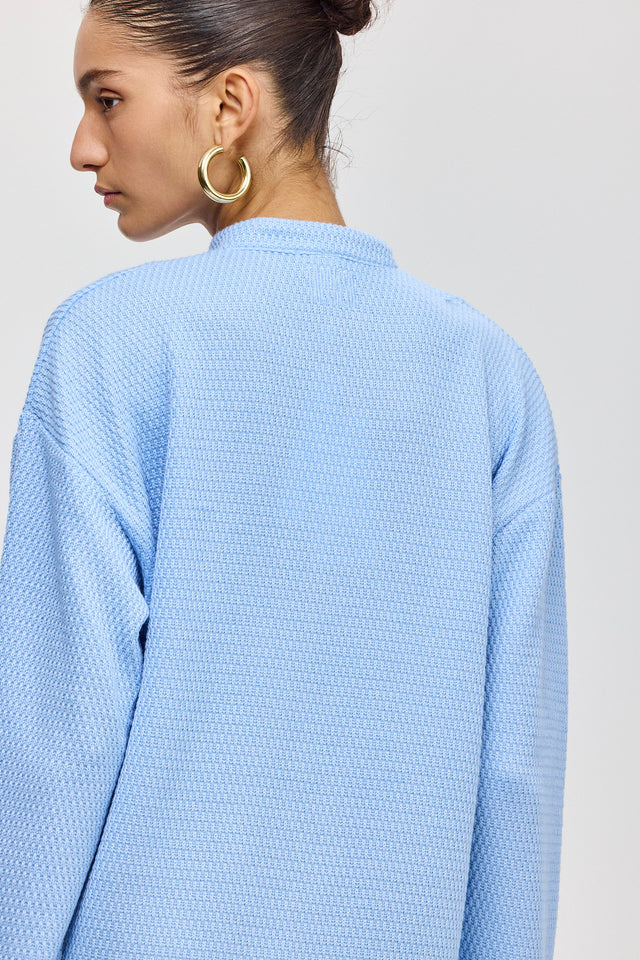 חולצת זיפר סריג ספייסי שרוולים ארוכים תכלת